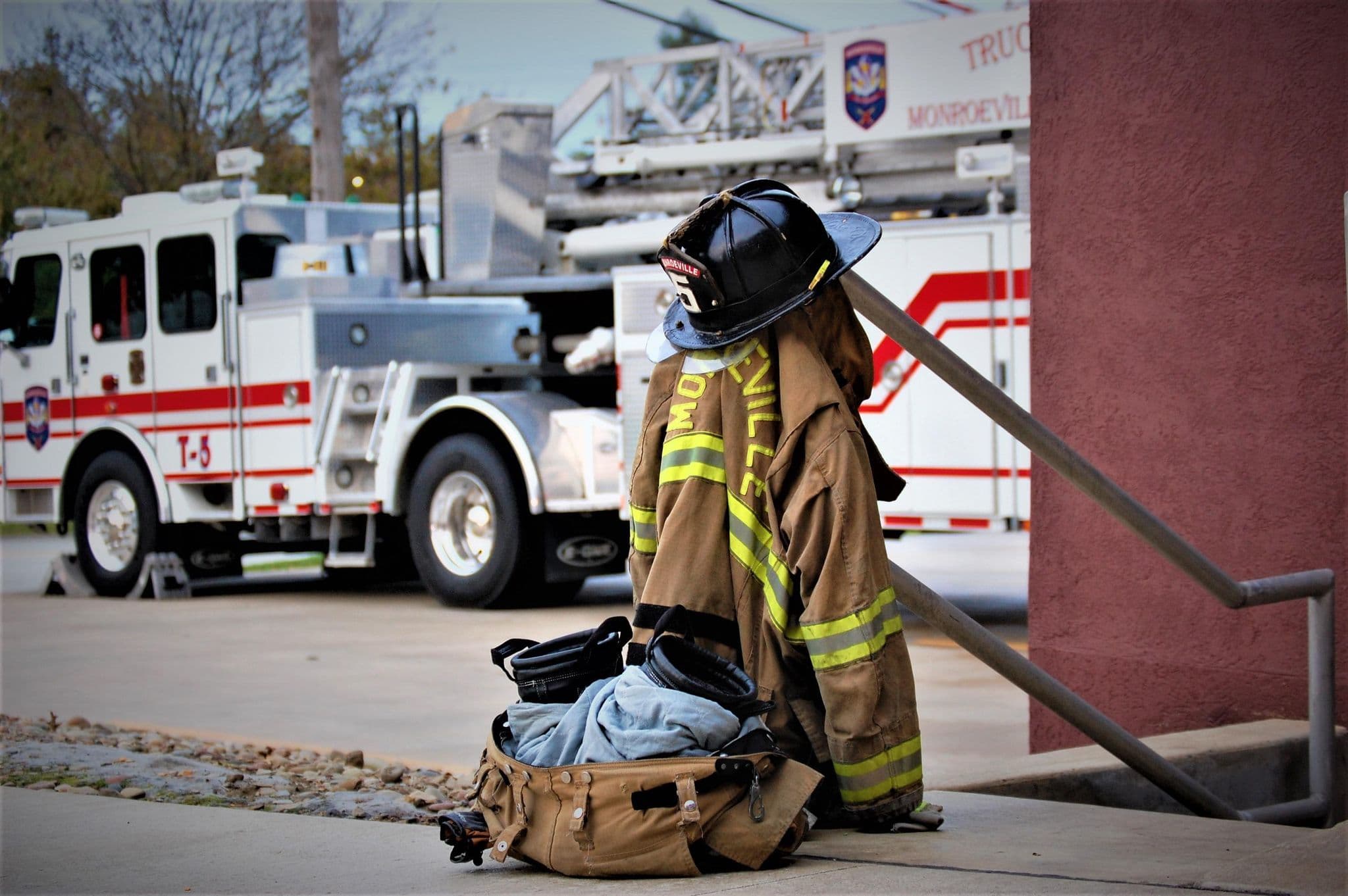 Turnout gear and helmet in front of Truck 5